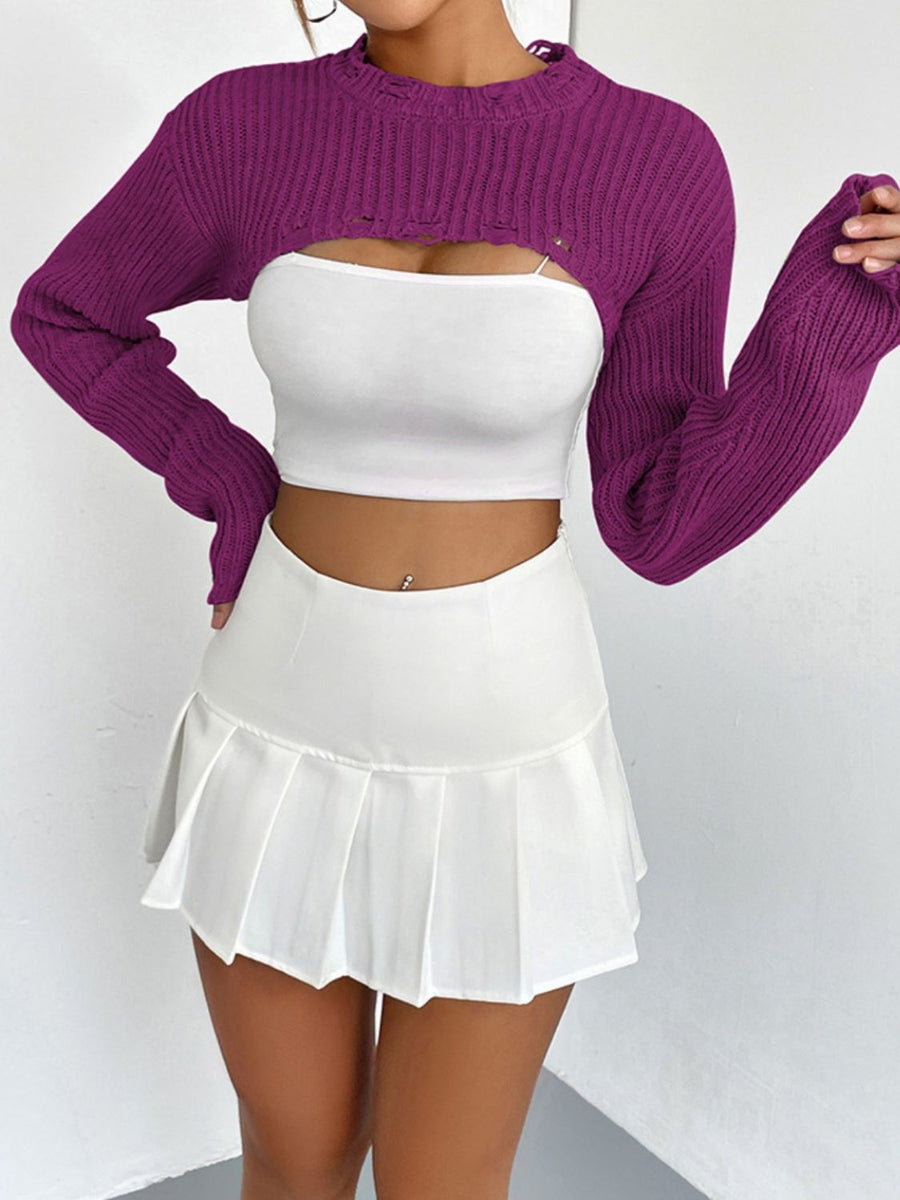 Fuchsia distressed knit bolero crop top with long sleeves and a raw hem.