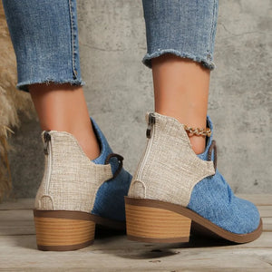 Ankle boots with denim and linen panels, back zippers, and wooden block heels.
