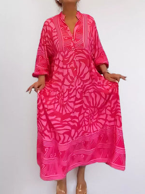 Hot Pink abstract print midi dress with button front and tiered skirt.