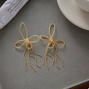 earrings in gold with tassel and long