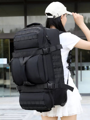 Black tactical backpack with multiple compartments and MOLLE webbing.