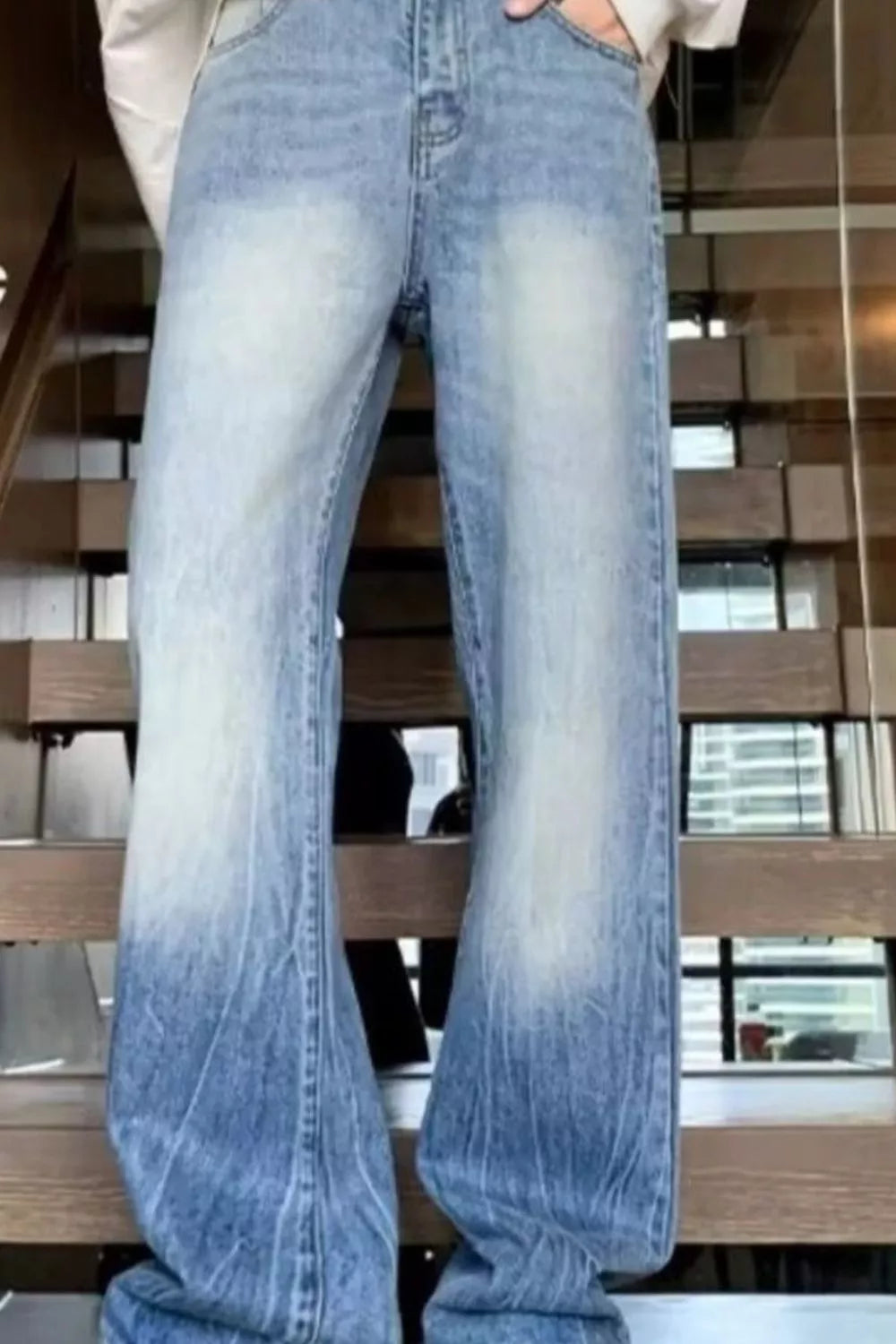 Men's light wash denim wide-leg jeans with ombre fading and vintage wash