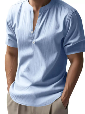 Light blue relaxed-fit men's overshirt with band collar and button detail.