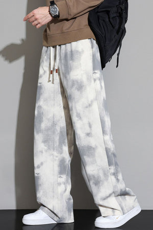 Relaxed fit sweatpants in off-white with a grey cloud pattern and drawstring waist.