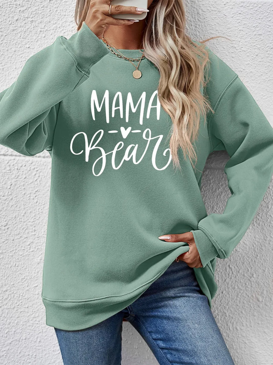 Sage green Mama Bear graphic sweatshirt with crewneck and long sleeves.