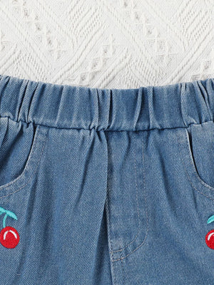 Baby denim shorts with elastic waist and cherry embroidery detail.