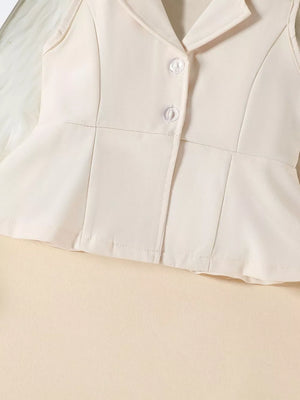 Beige sleeveless blazer with peplum hem and two clear buttons, part of a baby outfit.