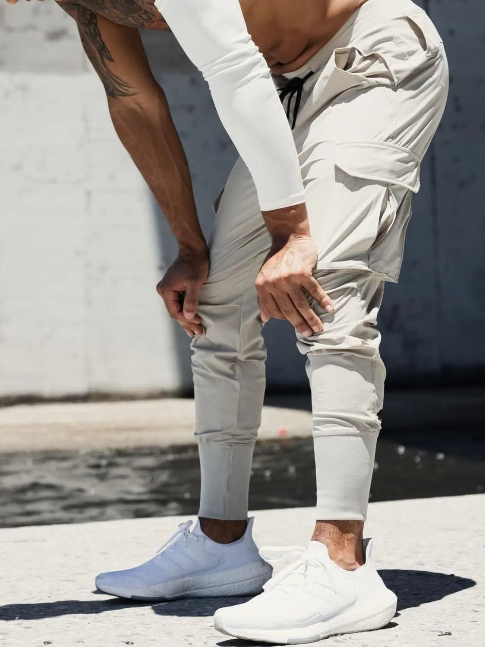 Technical cargo joggers in mocha with ribbed cuffs and multiple pockets.
