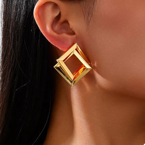 Gold earrings featuring gold-plated and geometric