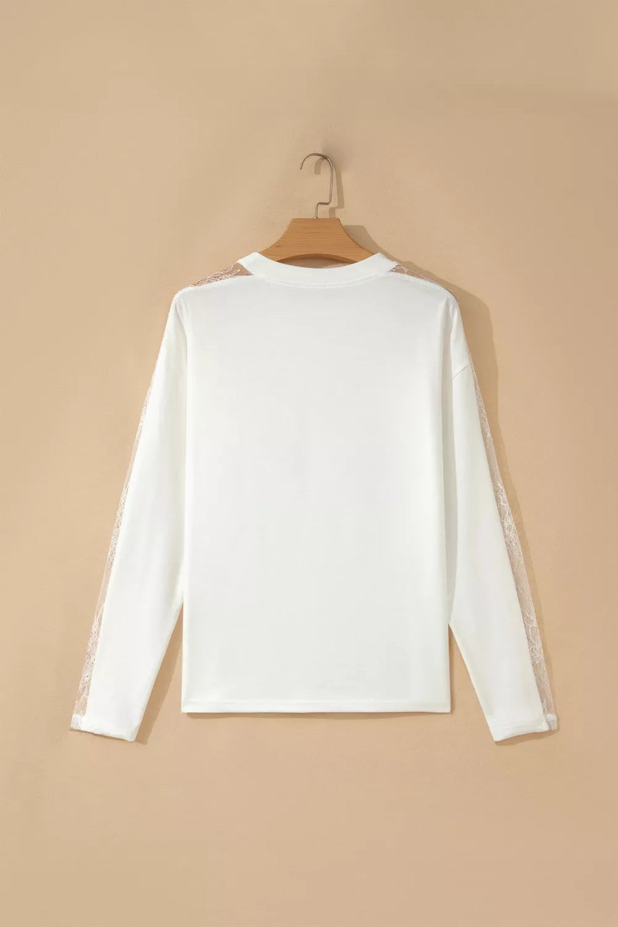White long sleeve crew neck shirt with delicate lace details on the sleeves.