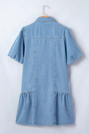 Light blue denim dress with puff sleeves, ruffled hem, and button front detail.