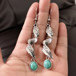 Silver leaf dangle earrings with turquoise oval stones