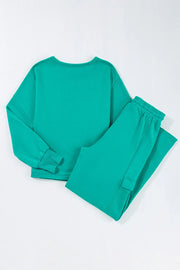 Turquoise loungewear set with crewneck sweatshirt and cargo pocket pants.