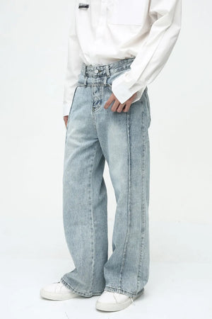 Medium wash denim wide-leg jeans with vertical seams and a high waist.