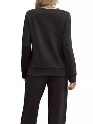 Black casual long-sleeve top and pants set with drawstring detail.