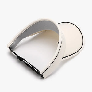 Ivory textured visor with black contrast piping and adjustable strap