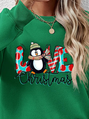 Green festive penguin graphic sweatshirt with LOVE Christmas text.