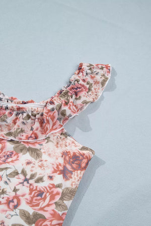 Floral ruffle tank top with sheer polyester fabric and ruffled neckline.
