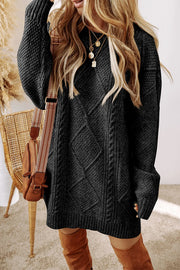 Black cable knit sweater dress with diamond pattern and ribbed trim.