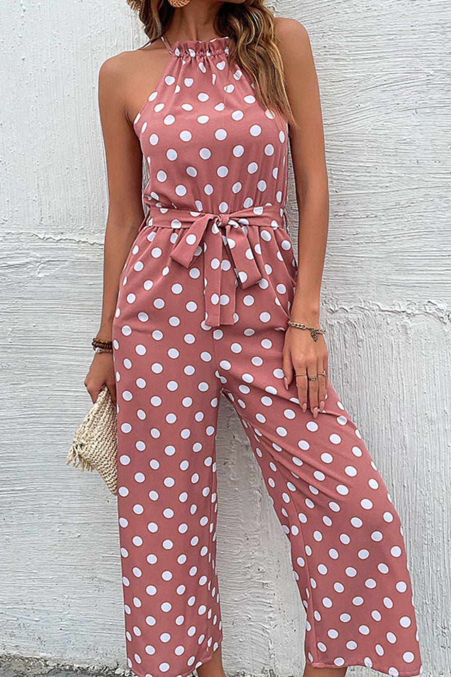 Pink polka dot halter neck palazzo jumpsuit with tie belt