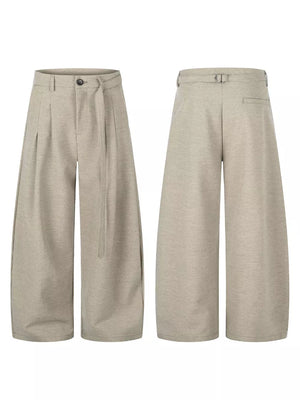 Tan wide-leg pants with full-length and button, zip-front