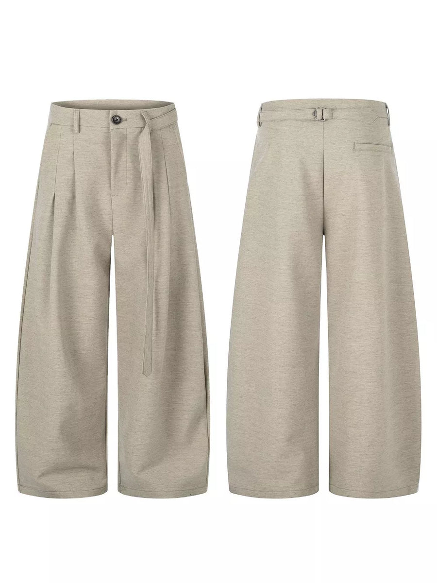 Tan wide-leg pants with full-length and button, zip-front