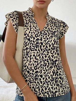 Leopard print blouse with ruffled collar and cap sleeves, v-neck.