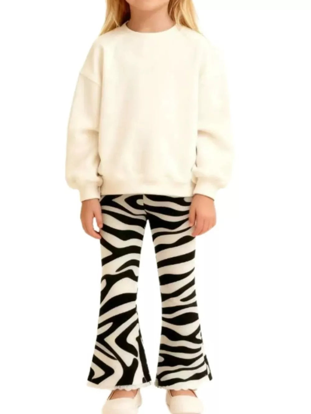 Zebra print flare pants for kids, black and white animal print trousers with a flared leg.