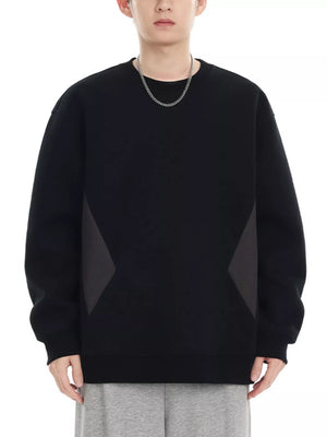Black oversized cotton crew-neck sweatshirt with dark gray geometric panel details on sides.