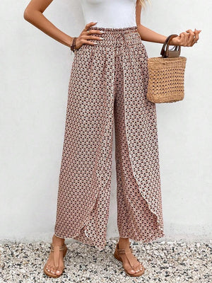 Floral print wrap-front palazzo pants in blush pink with a geometric pattern.