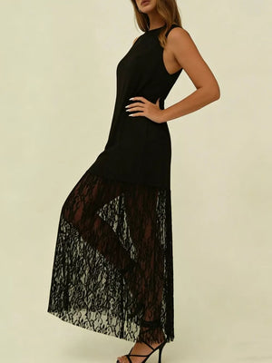 Black sleeveless maxi dress with lace trim skirt and high neckline.