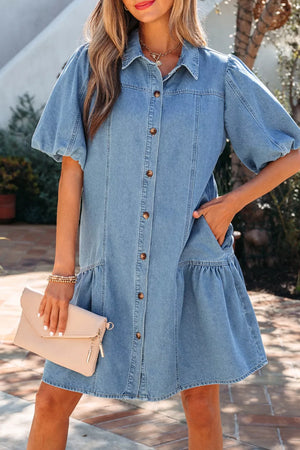 Denim dress with puff sleeves, ruffled hem, and button front.