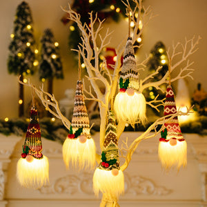 Illuminated gnome ornaments with patterned hats and glowing white beards, available in multiple styles.