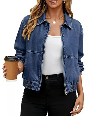 denim jacket in medium blue featuring washed and relaxed fit