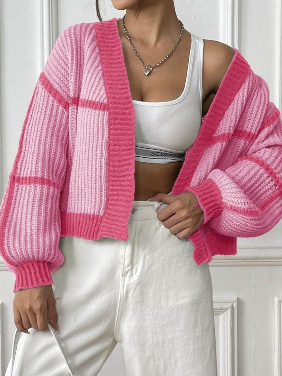 cardigan in light pink featuring ribbed and relaxed fit