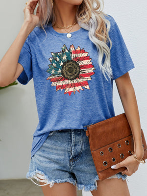 Cobalt blue graphic tee with American flag sunflower print, crew neck, short sleeves.