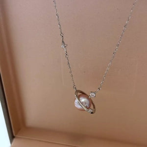 Celestial pearl and silver pendant necklace with cubic zirconia accents.