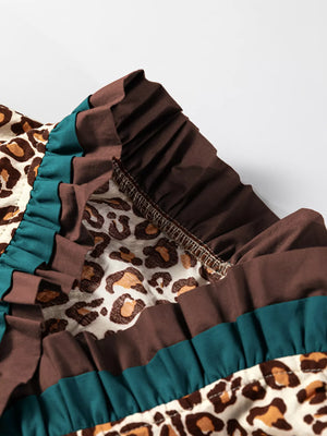 Leopard print button-down shirt with brown and teal frilled trim detail.