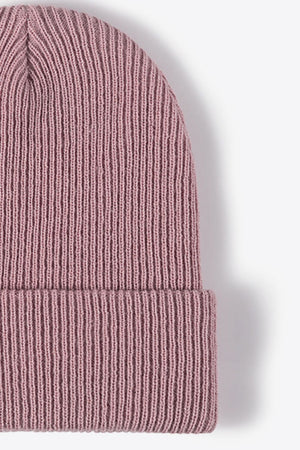 Ribbed knit beanie in pink with a cuffed brim.