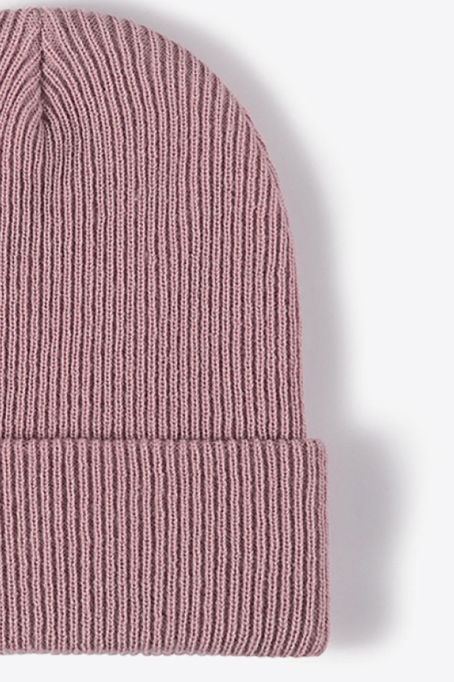 Ribbed knit beanie in pink with a cuffed brim.