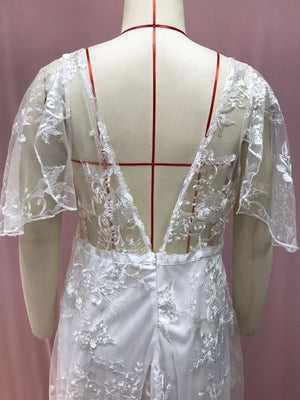 White lace flutter sleeve v-neck dress with embroidered detail