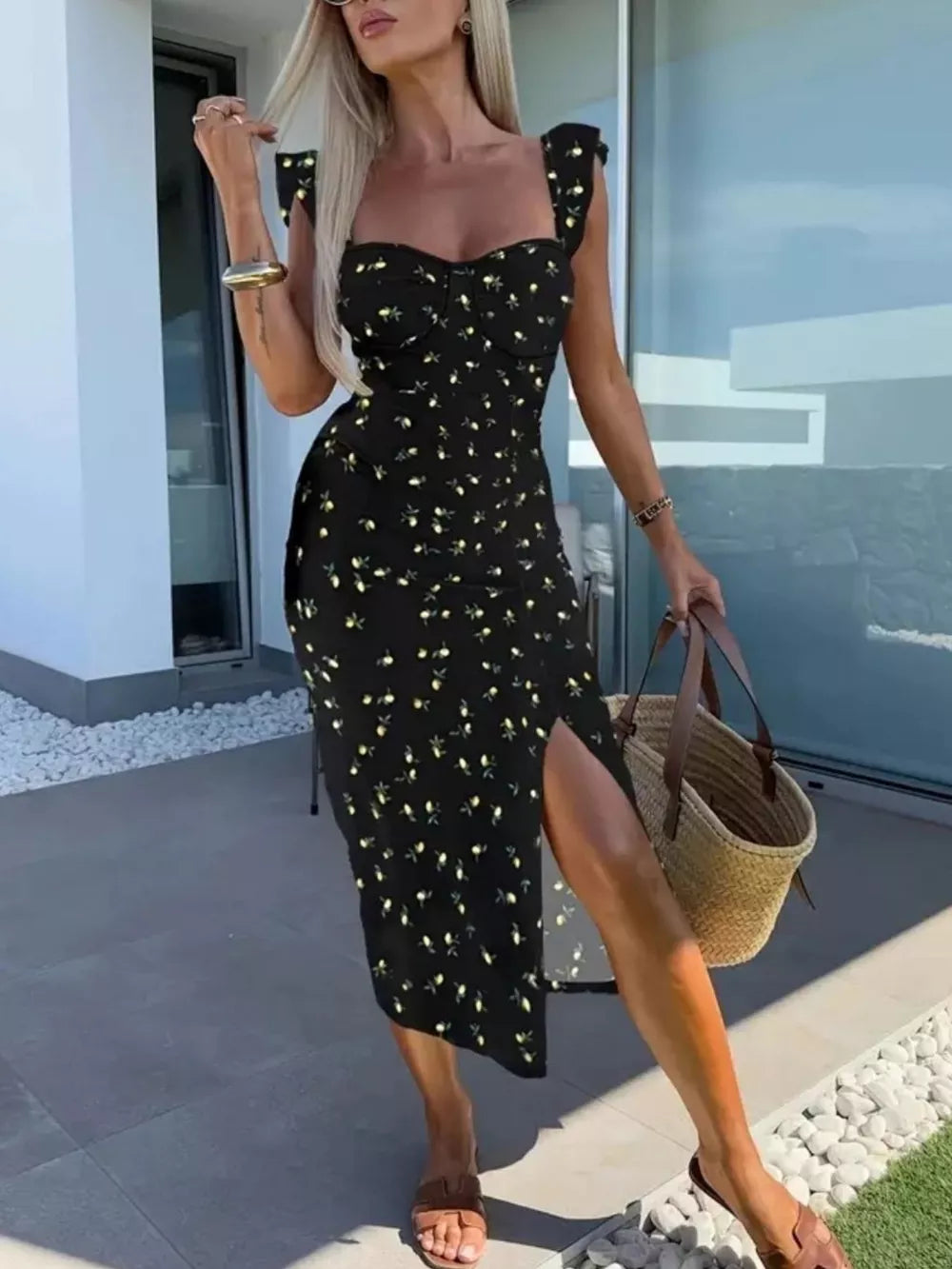 Black floral sweetheart midi dress with ruffle sleeves and a high slit.
