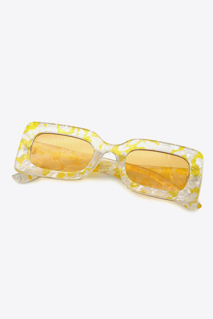 Swirl print rectangular frame sunglasses in Butter Yellow with orange lenses.