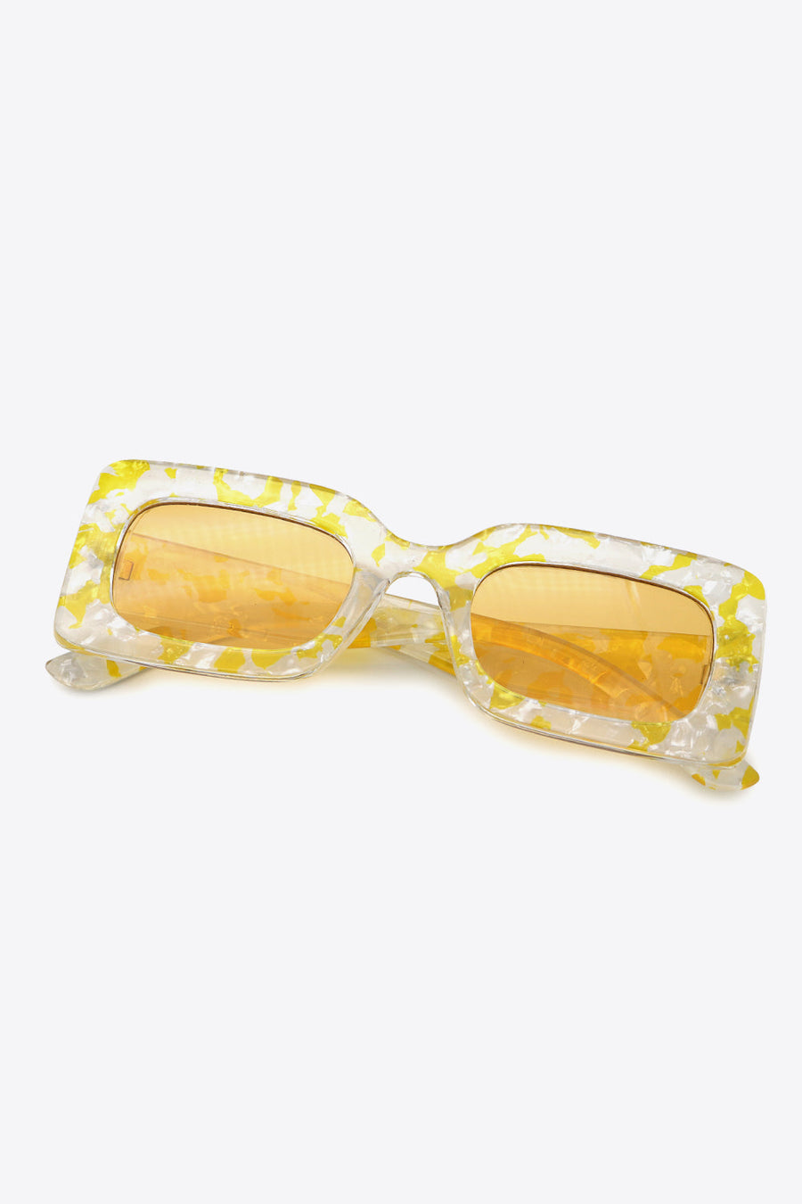Swirl print rectangular frame sunglasses in Butter Yellow with orange lenses.