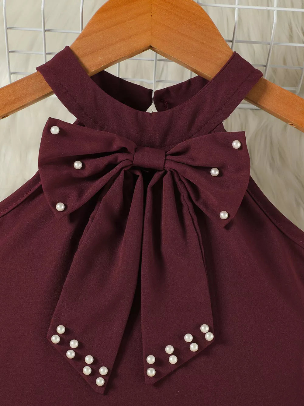 Burgundy toddler set top with pearl bowknot detail and halter neck.