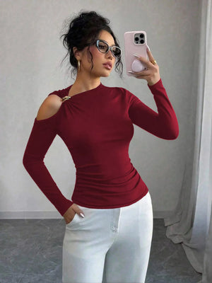Burgundy long sleeve t-shirt with cutout shoulder detail and gold ring accent.
