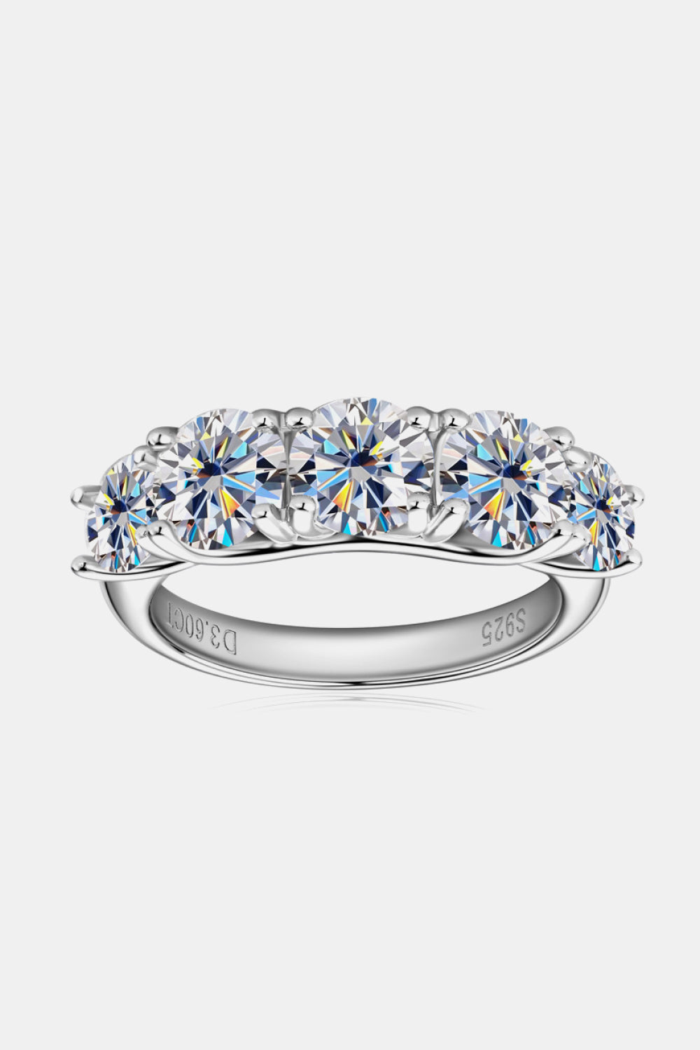 Silver five-stone moissanite eternity band ring with round brilliant cut stones.