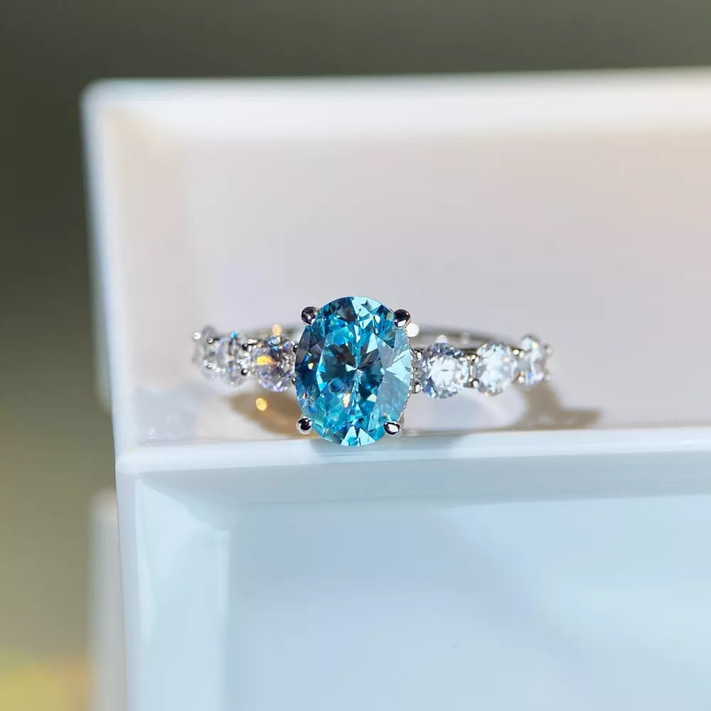ring in sky blue featuring oval cut stone and fitted fit