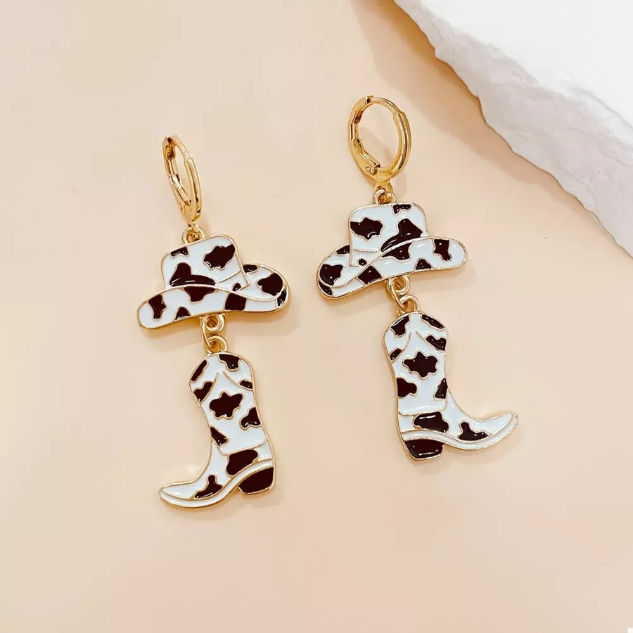 black earrings featuring dangle and cow print
