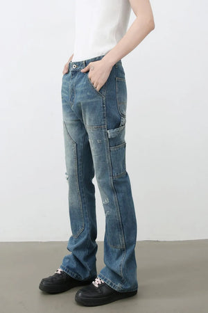 Carpenter flare jeans in medium wash denim with distressed details and a relaxed fit.